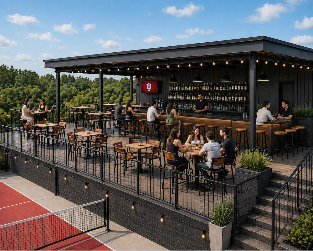 Rooftop bar with string lights and guests seated at high tables