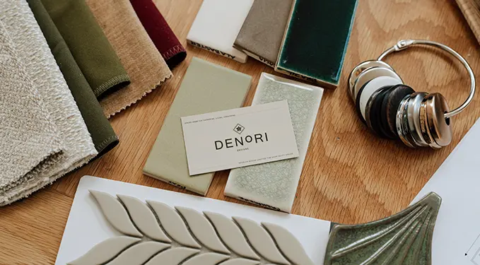 Denori Designs material samples laid out on a timber table