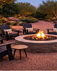 Fire pit with Adirondack chairs in a desert garden at dusk