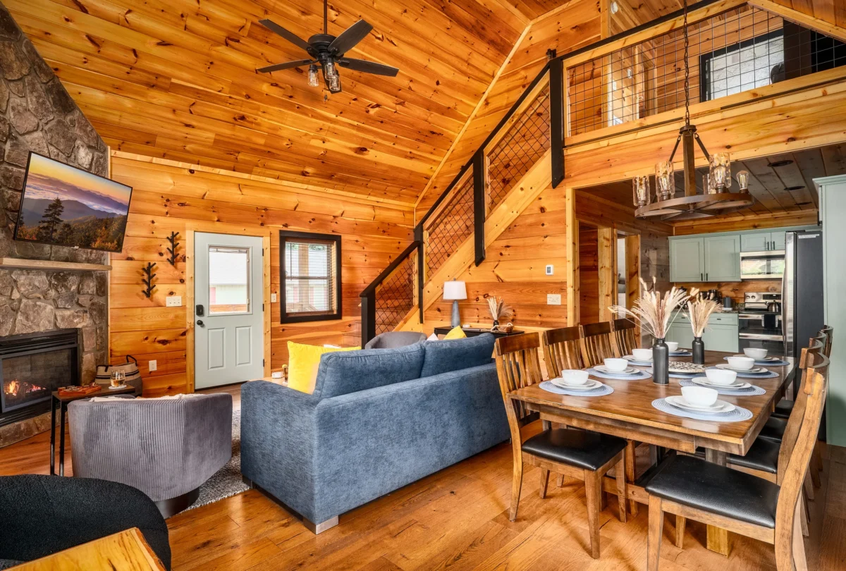 Open living and dining room seen from the loft stairs