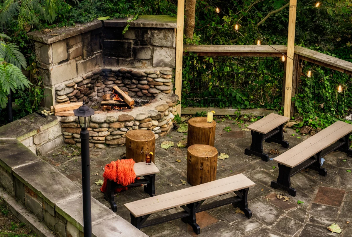 Stone fire pit with bench seating in the garden