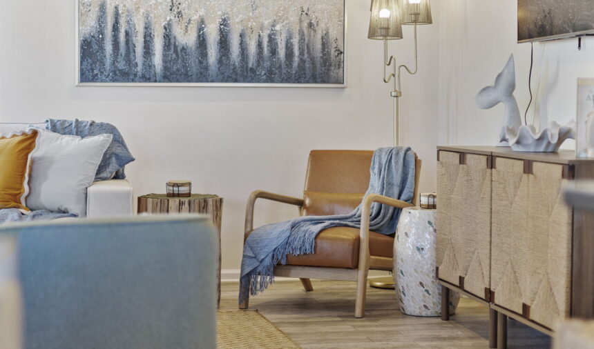 Reading corner with a leather armchair and a forest painting