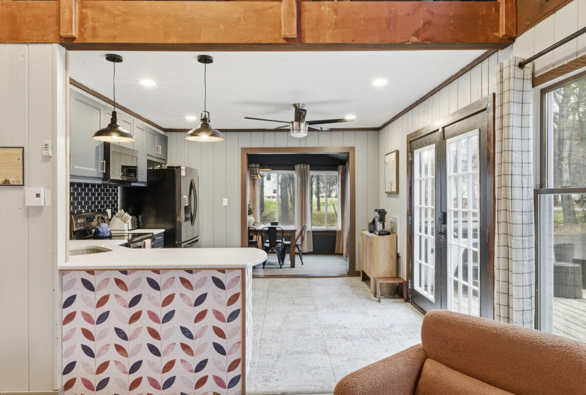 Open-plan kitchen and dining room with a patterned breakfast bar