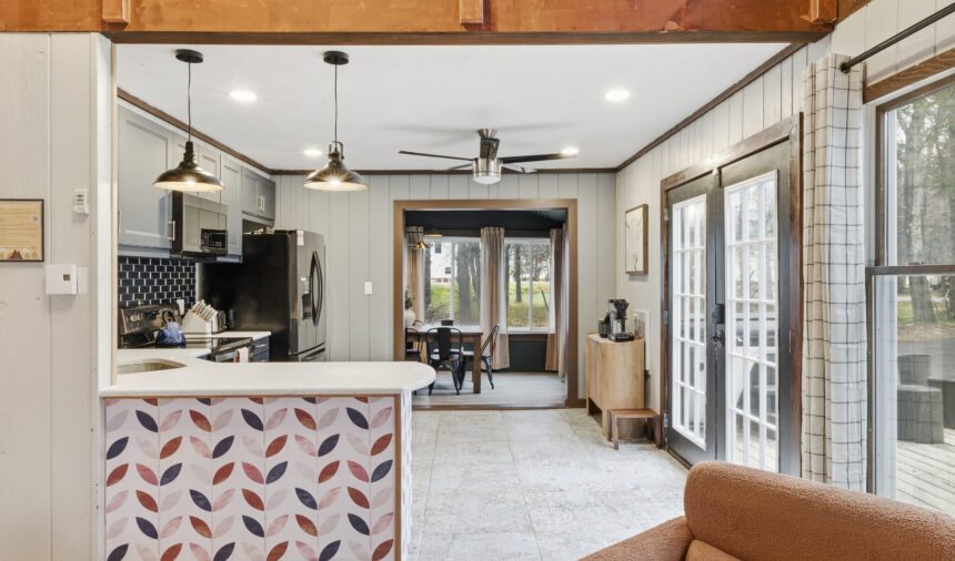 Open-plan kitchen and dining room with a patterned breakfast bar