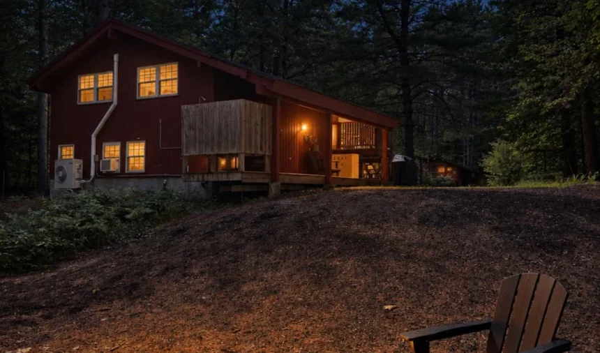 The fire pit lit among the pines after dark