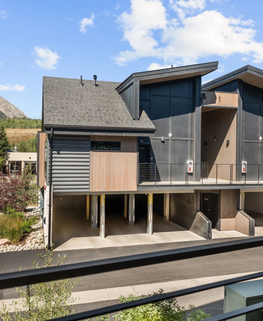 The condo building with the mountain behind it