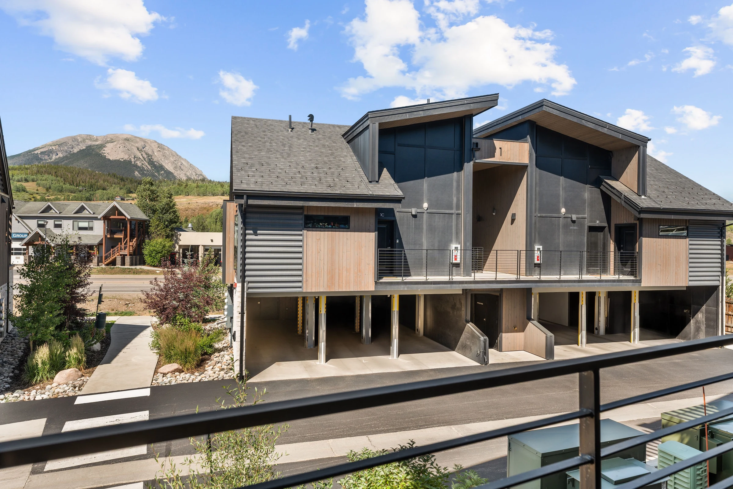 The condo building with the mountain behind it