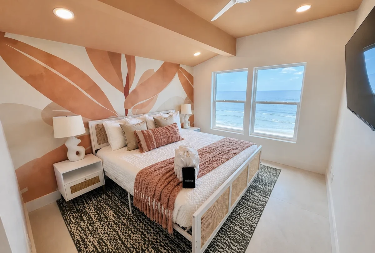 Bedroom with a coral floral mural above the headboard