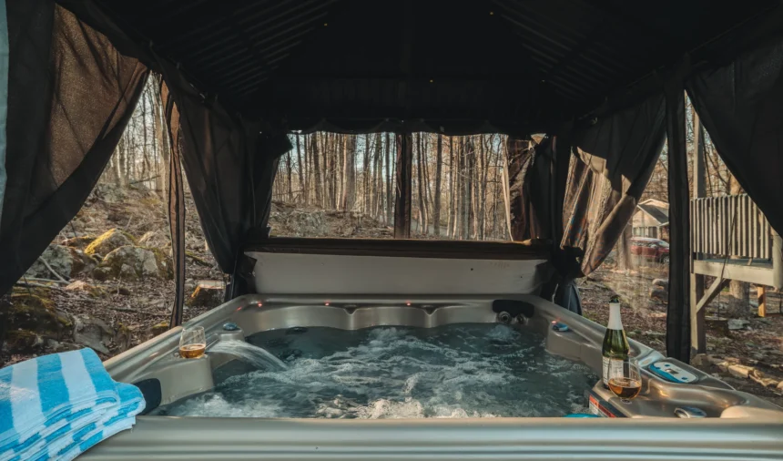 Hot tub under a covered pergola on the deck