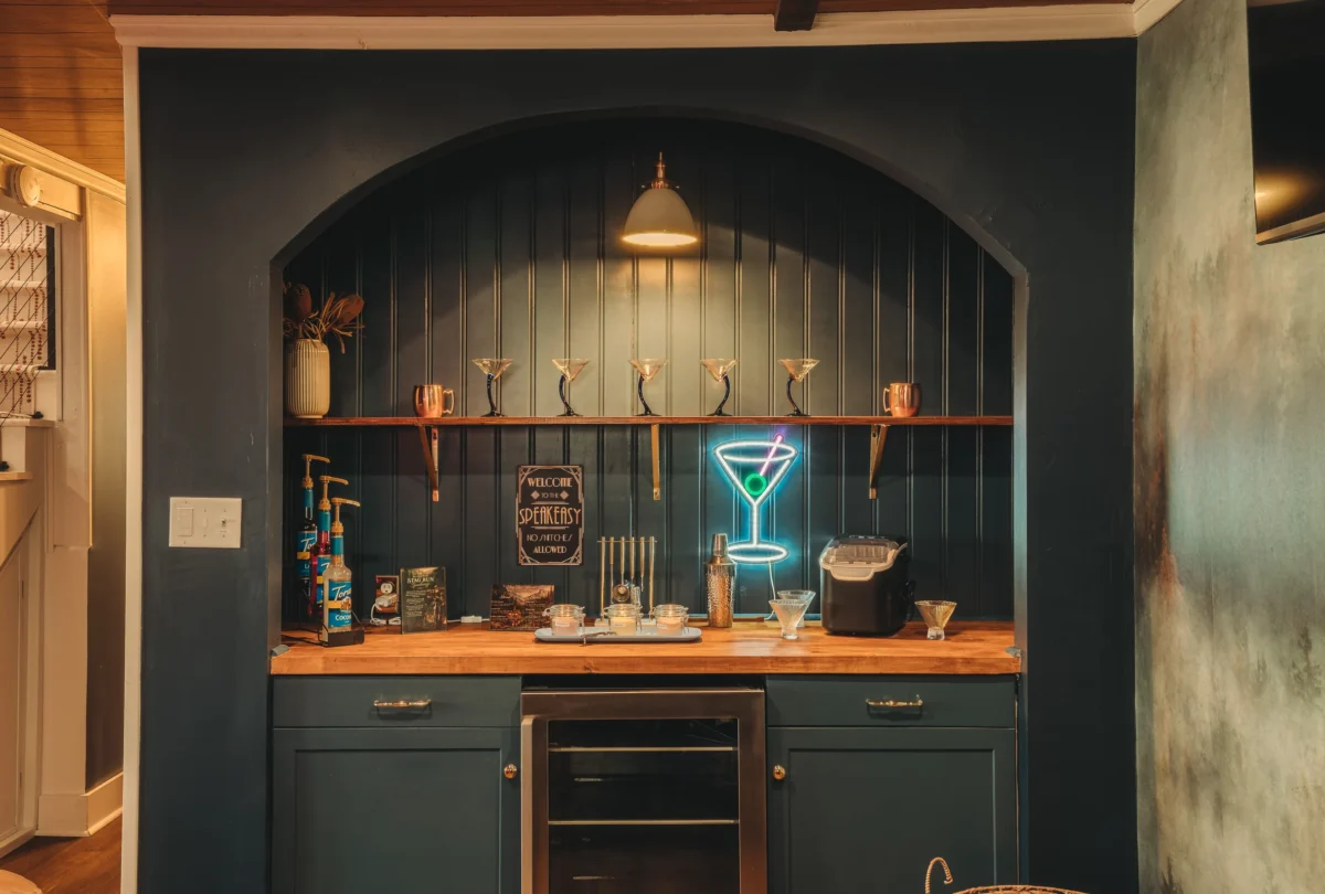 Speakeasy bar nook with a neon cocktail sign