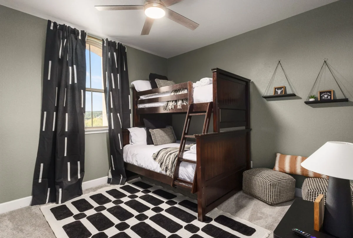 Bunk room with a black and white rug