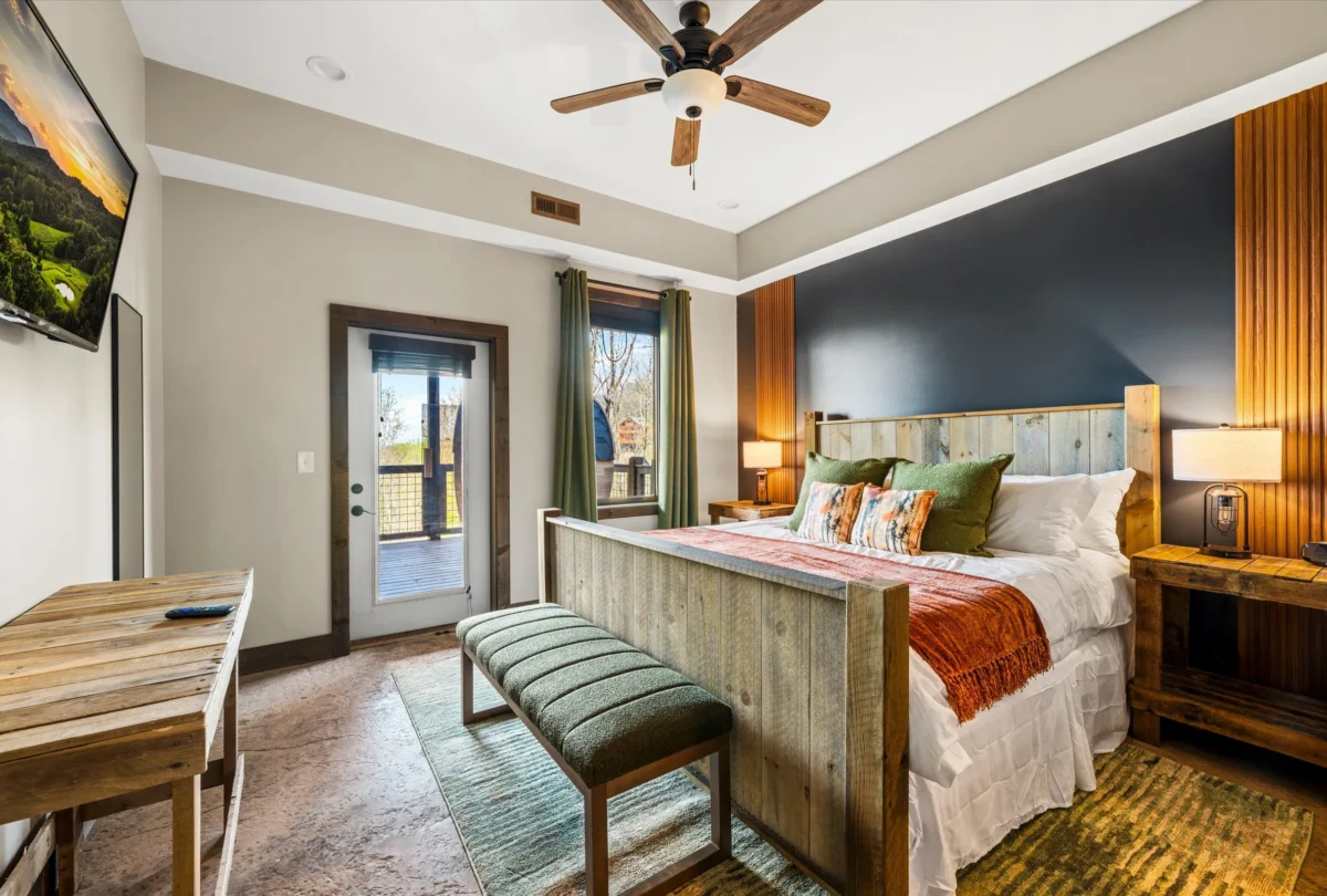 Bedroom with a timber headboard and rust and green bedding