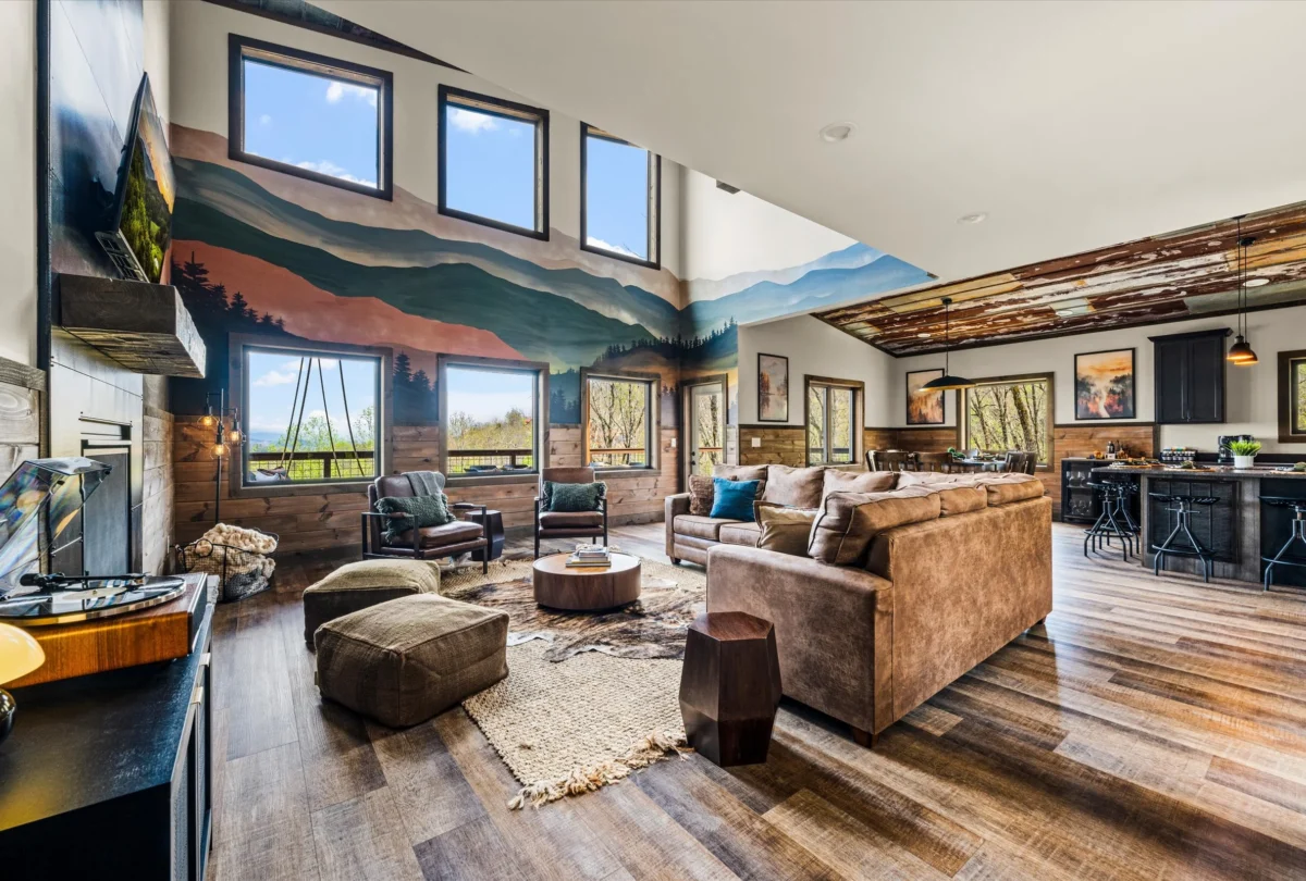 Open living room with leather sofas under a double-height ceiling