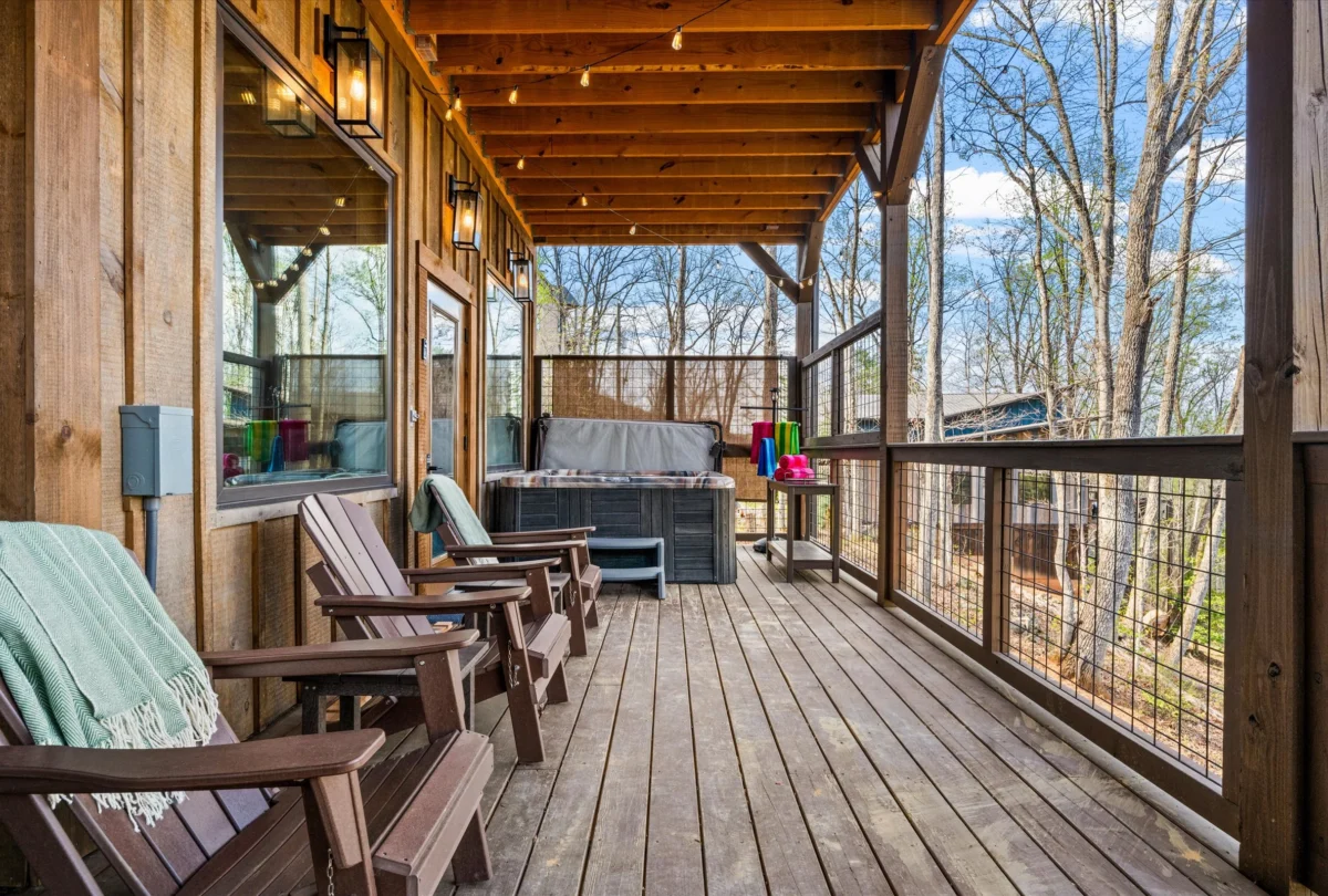 Covered porch running the length of the cabin, with rocking chairs